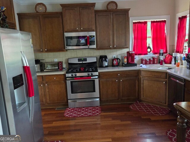 3932 Misty Lk, Ellenwood, GA 30294 - kitchen with stainless steel appliances, dark wood-type flooring, light countertops, and a sink
