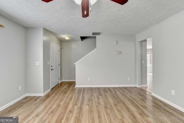 2355 Glen Chase Ln, Lawrenceville, GA 30044 - unfurnished room with ceiling fan, a textured ceiling, wood finished floors, and baseboards