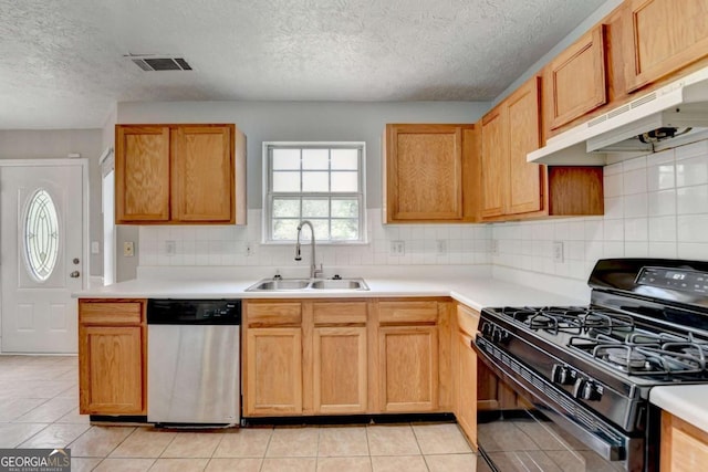 2355 Glen Chase Ln, Lawrenceville, GA 30044 - kitchen featuring black gas range, dishwasher, a sink, under cabinet range hood, and a textured ceiling