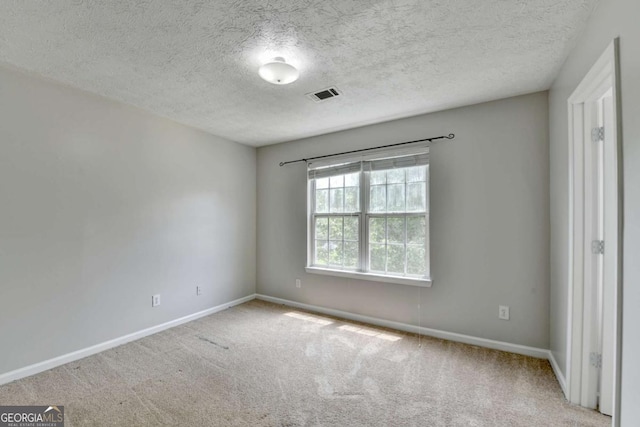 2355 Glen Chase Ln, Lawrenceville, GA 30044 - carpeted spare room with baseboards and a textured ceiling