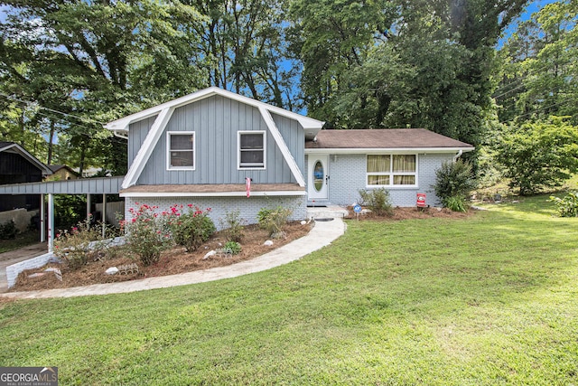 2950 Springfield Ct SW, College Park, GA 30349 - view of front of home featuring a front yard, board and batten siding, brick siding, and roof with shingles