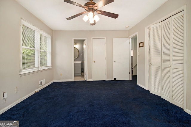 2950 Springfield Ct SW, College Park, GA 30349 - unfurnished bedroom featuring baseboards, carpet flooring, ensuite bath, and a ceiling fan