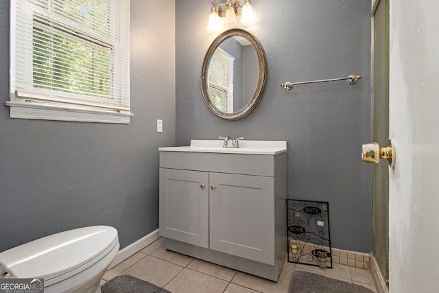 2950 Springfield Ct SW, College Park, GA 30349 - bathroom with tile patterned flooring, vanity, toilet, and baseboards