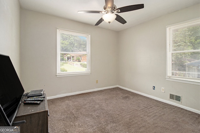 2950 Springfield Ct SW, College Park, GA 30349 - empty room with carpet flooring, baseboards, a ceiling fan, and an office area