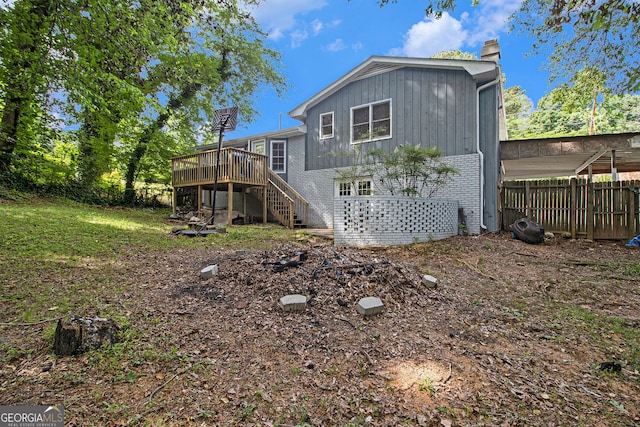 2950 Springfield Ct SW, College Park, GA 30349 - rear view of house featuring a chimney, stairway, a deck, and brick siding