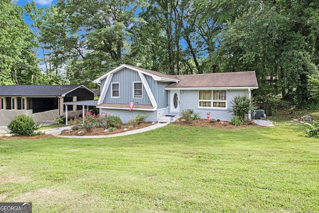 2950 Springfield Ct SW, College Park, GA 30349 - view of front facade featuring brick siding, a front lawn, a shingled roof, and board and batten siding