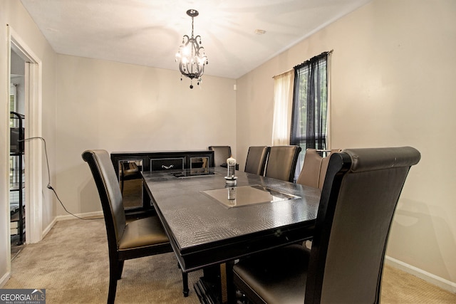2950 Springfield Ct SW, College Park, GA 30349 - dining space featuring light carpet, baseboards, and a chandelier