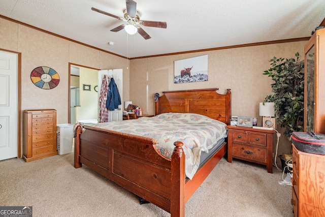 bedroom with ornamental molding, light carpet, ceiling fan, and a textured ceiling