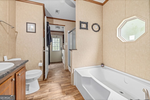 full bath with ornamental molding, wood finished floors, vanity, a shower stall, and a garden tub