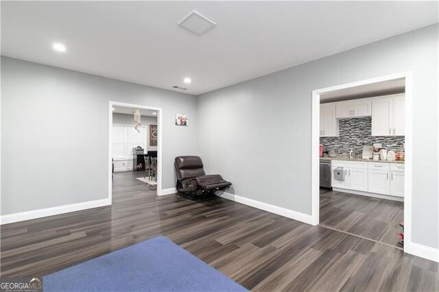 2221 Baker Carter Dr, Loganville, GA 30052 - sitting room featuring dark wood-type flooring, recessed lighting, and baseboards