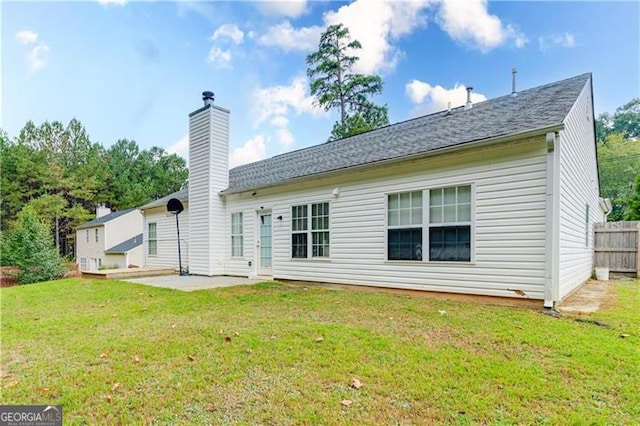 2221 Baker Carter Dr, Loganville, GA 30052 - back of property featuring a chimney and a patio