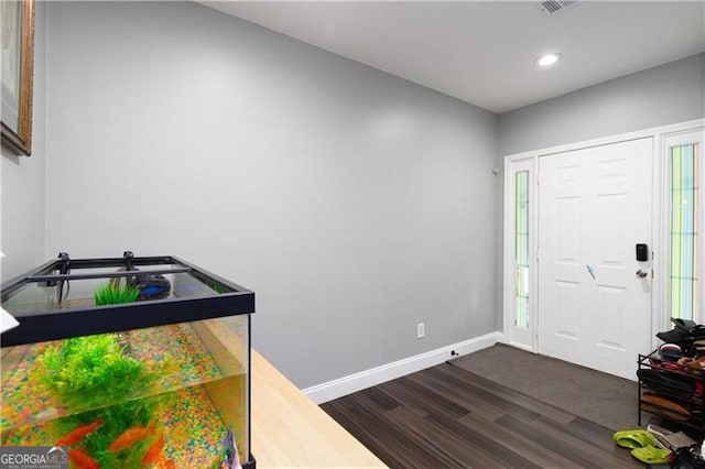 2221 Baker Carter Dr, Loganville, GA 30052 - entrance foyer with dark wood-style flooring, baseboards, recessed lighting, and plenty of natural light