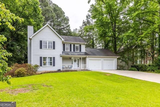 traditional home featuring a porch, an attached garage, concrete driveway, a chimney, and a front lawn