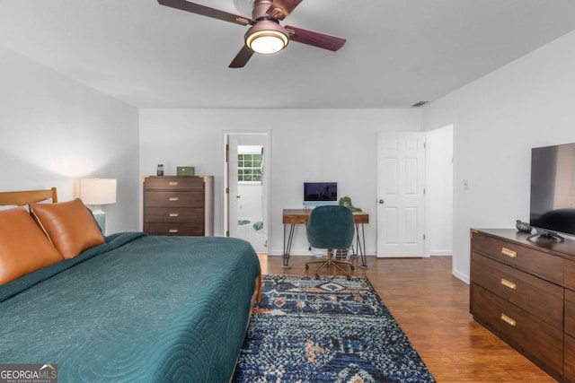 bedroom featuring dark wood finished floors, baseboards, and ceiling fan