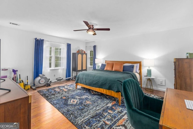 bedroom with wood finished floors and ceiling fan