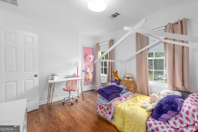 bedroom with wood finished floors
