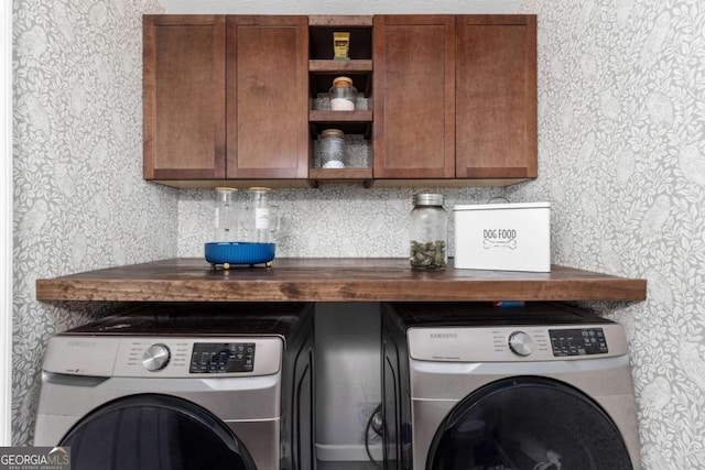 laundry room featuring cabinet space