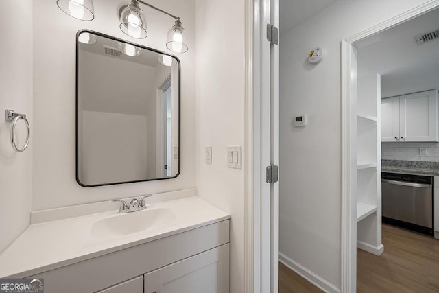 510 Northridge Crossing Dr, Sandy Springs, GA 30350 - bathroom featuring wood finished floors, vanity, and tasteful backsplash