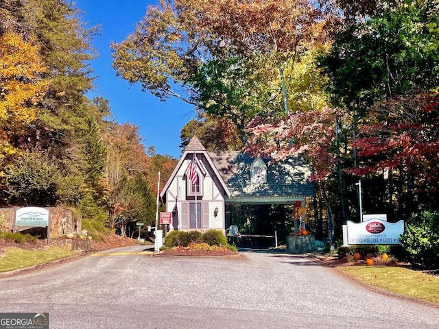 view of asphalt street featuring curbs