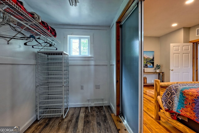 spacious closet with wood finished floors