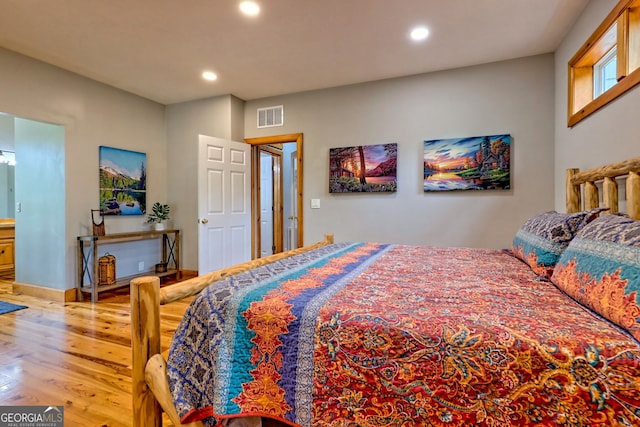 bedroom with light wood-style floors, recessed lighting, and baseboards