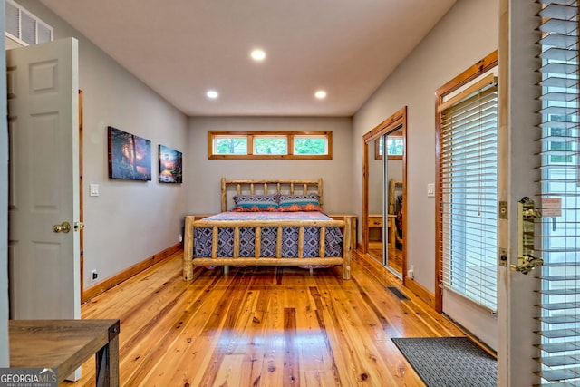 bedroom with light wood-style flooring, recessed lighting, and baseboards