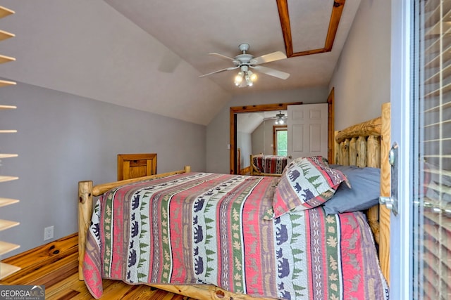 bedroom with lofted ceiling, wood finished floors, and ceiling fan