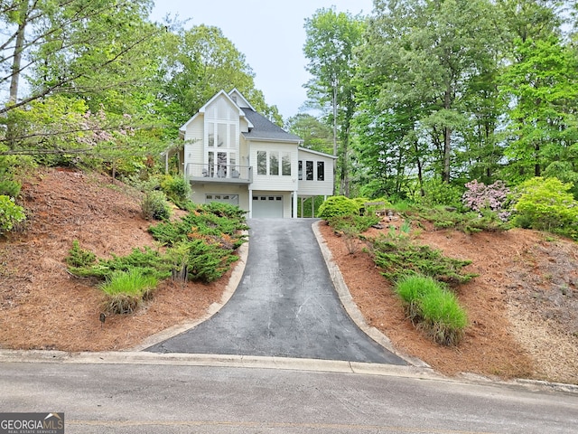 view of front of home featuring asphalt driveway and an attached garage
