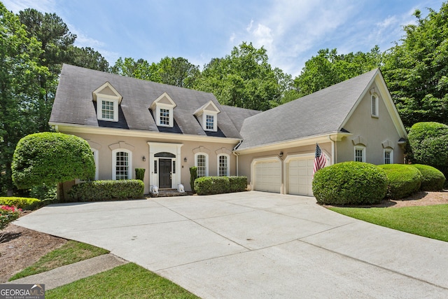4070 Ridgehurst Dr SE, Smyrna, GA 30080 - cape cod home featuring stucco siding, an attached garage, and concrete driveway