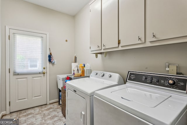 4070 Ridgehurst Dr SE, Smyrna, GA 30080 - laundry area with cabinet space, independent washer and dryer, and baseboards