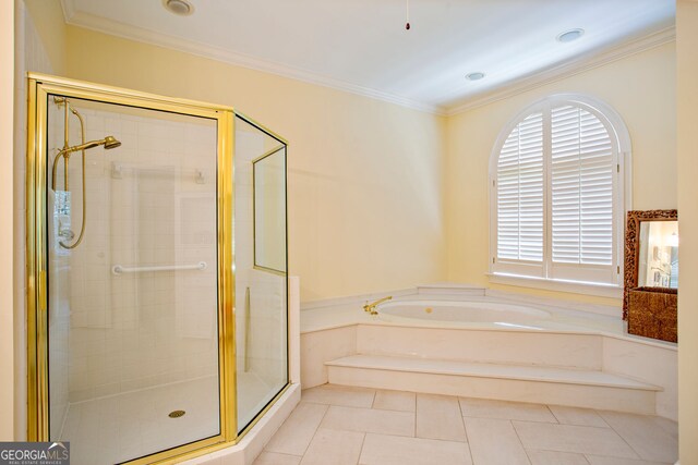 4070 Ridgehurst Dr SE, Smyrna, GA 30080 - bathroom featuring a stall shower, a bath, crown molding, and tile patterned flooring