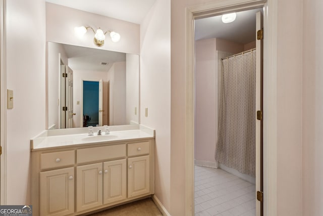 4070 Ridgehurst Dr SE, Smyrna, GA 30080 - bathroom with baseboards, vanity, and tile patterned floors