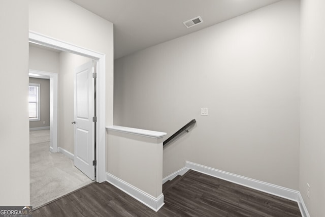 896 Farmstead Rd Unit 162, Suwanee, GA 30024 - hallway featuring an upstairs landing, wood finished floors, and baseboards