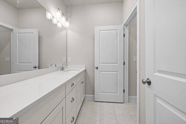 896 Farmstead Rd Unit 162, Suwanee, GA 30024 - bathroom featuring tile patterned floors, vanity, and baseboards