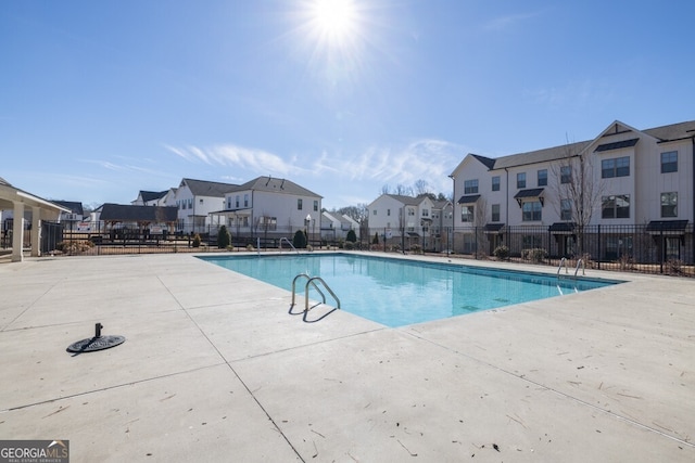 896 Farmstead Rd Unit 162, Suwanee, GA 30024 - community pool with a residential view, fence, and a patio area