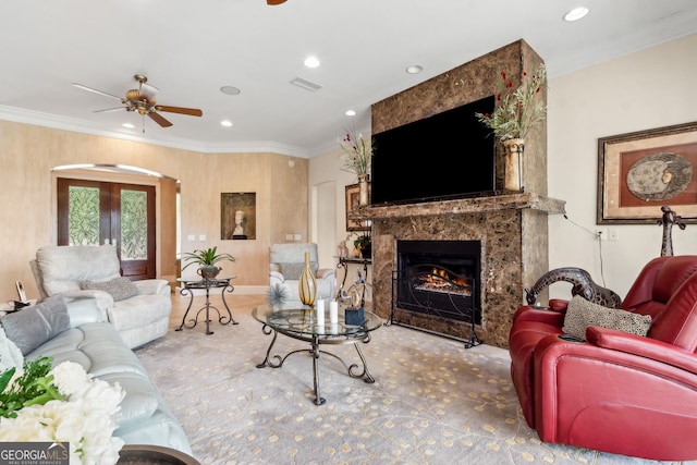 364 Osprey Cir, Saint Marys, GA 31558 - living area with arched walkways, ornamental molding, a high end fireplace, a ceiling fan, and recessed lighting