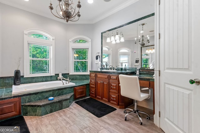 364 Osprey Cir, Saint Marys, GA 31558 - bathroom with a chandelier, healthy amount of natural light, a garden tub, vanity, and ornamental molding