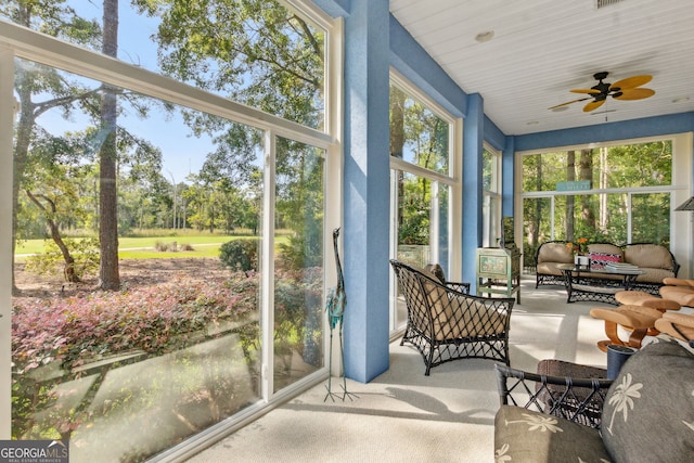 364 Osprey Cir, Saint Marys, GA 31558 - sunroom / solarium with ceiling fan, outdoor lounge area, and view of wooded area