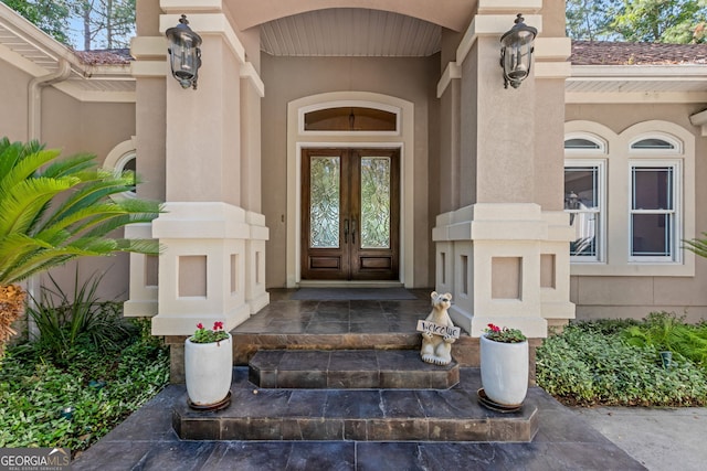 364 Osprey Cir, Saint Marys, GA 31558 - doorway to property with french doors and stucco siding