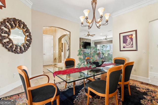 364 Osprey Cir, Saint Marys, GA 31558 - dining area featuring arched walkways, a chandelier, ornamental molding, baseboards, and a ceiling fan