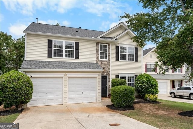 411 Sugar Maple Ct, Canton, GA 30114 - traditional home featuring an attached garage, concrete driveway, and roof with shingles