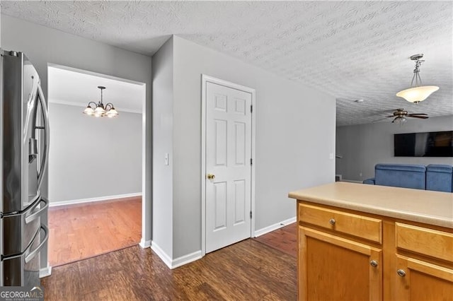 411 Sugar Maple Ct, Canton, GA 30114 - kitchen featuring stainless steel refrigerator with ice dispenser, dark wood-style flooring, ceiling fan, a chandelier, and pendant lighting