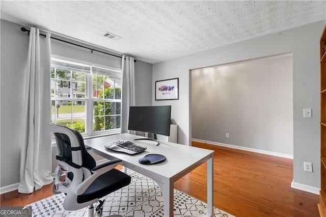 411 Sugar Maple Ct, Canton, GA 30114 - office space featuring wood finished floors, baseboards, and a textured ceiling