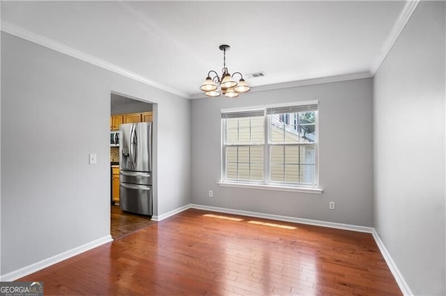 411 Sugar Maple Ct, Canton, GA 30114 - empty room featuring a chandelier, dark wood-style floors, crown molding, and baseboards