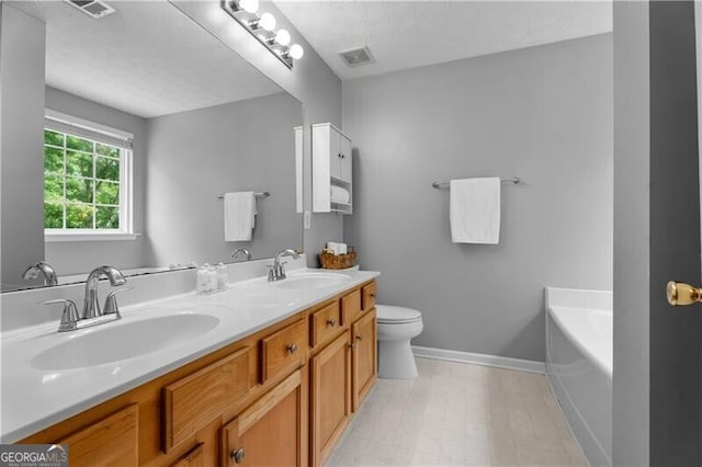 411 Sugar Maple Ct, Canton, GA 30114 - full bathroom with baseboards, a bath, double vanity, and toilet