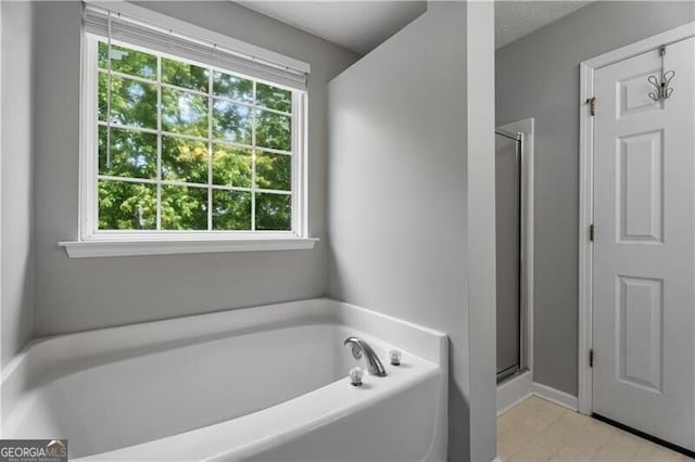411 Sugar Maple Ct, Canton, GA 30114 - bathroom with a garden tub and a stall shower