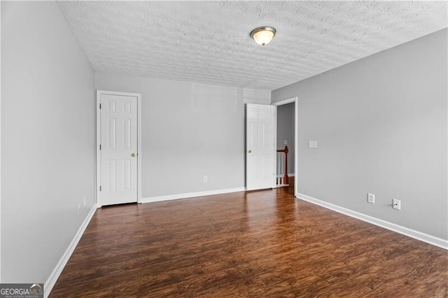 411 Sugar Maple Ct, Canton, GA 30114 - spare room with a textured ceiling, wood finished floors, and baseboards