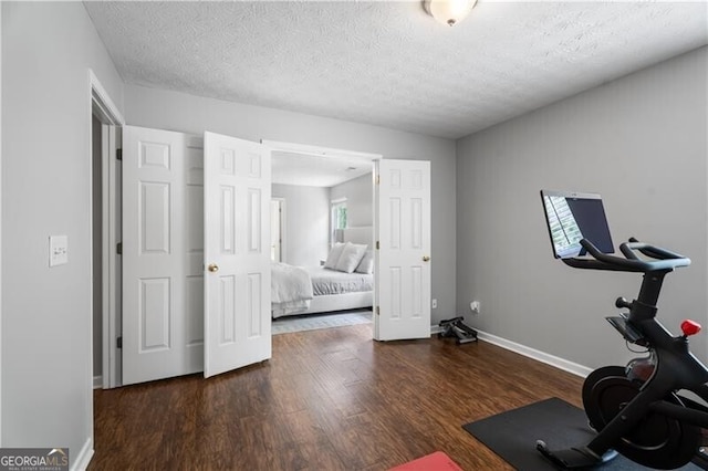 411 Sugar Maple Ct, Canton, GA 30114 - exercise area with wood finished floors, a textured ceiling, and baseboards