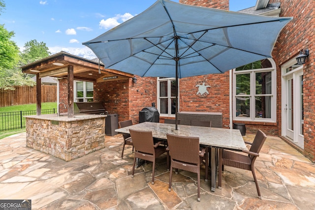 1610 Turtle Pond Dr, Hoschton, GA 30548 - view of patio / terrace featuring area for grilling and outdoor dining space