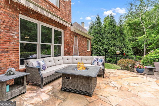 1610 Turtle Pond Dr, Hoschton, GA 30548 - view of patio featuring an outdoor living space with a fire pit